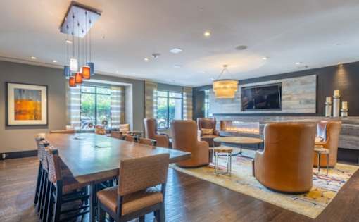 A modern dining room with a wooden table and chairs at Mira Upper Rock, Maryland, 20850