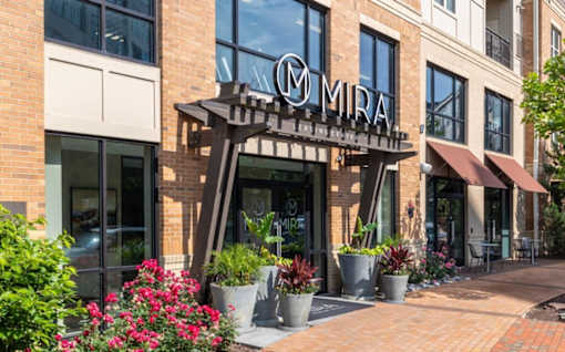 The front of a building with a sign that says at Mira Upper Rock, Maryland, 20850
