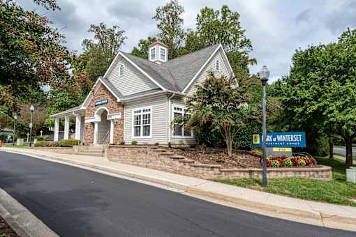Clubhouse exterior with stone accents and cupola at Park at Winterset Apartments, Owings Mills, Maryland