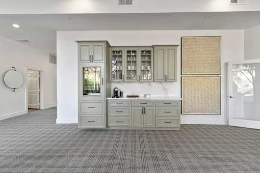 A kitchen with a sink, cabinets, and a window at Prairie Crossing, Farmers Branch, TX