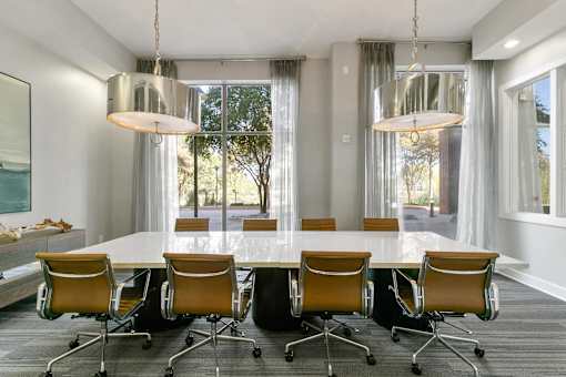 A conference room with a long table and chairs at Prairie Crossing, Texas 75244