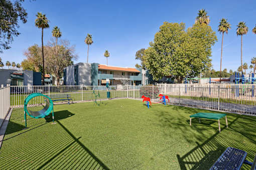 A playground with a green slide and a red slide at Riviera Park, Chandler Arizona