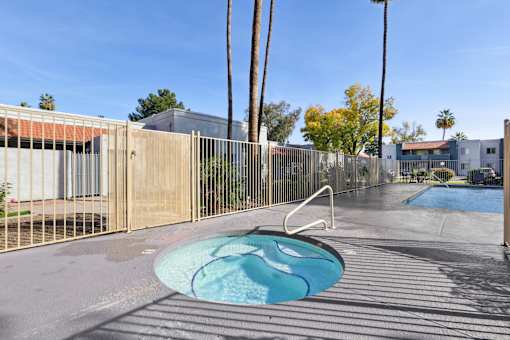 A small pool surrounded by a fence at Riviera Park, Chandler Arizona