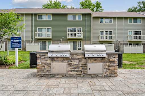 Stone builtin grilling stations with storage at The Brook At Columbia Apartments, Columbia, 21044