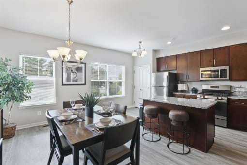 Kitchen and Dining area with wood floors at Townes at Pine Orchard, Ellicott City, 21042