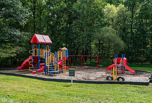 Playground with slides and climbing structures at Park at Winterset Apartments, Owings Mills, Maryland