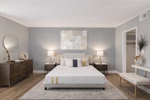 A bedroom with a large bed, nightstands, and a bench.