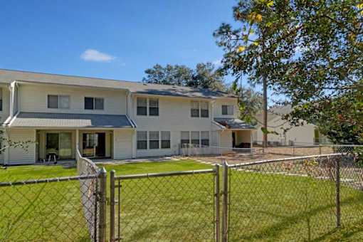 A house with a fence in front of it.