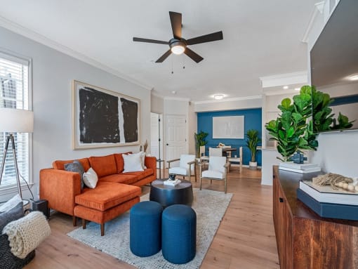 Spacious living room area with furniture and plank flooring