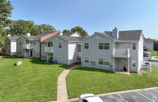 A row of houses with a car parked in front at Sedgefield Square Apartments, Greensboro, NC