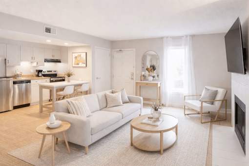 A modern living room with a white sofa and a coffee table.