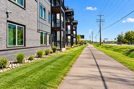 A long, narrow road runs between two buildings.