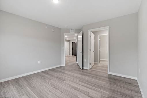 Balsam II Apartments bedroom with attached closet and bathroom
