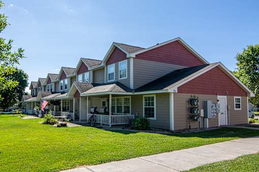 A row of houses with a red roof.