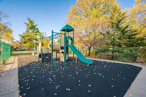 A playground with a green slide