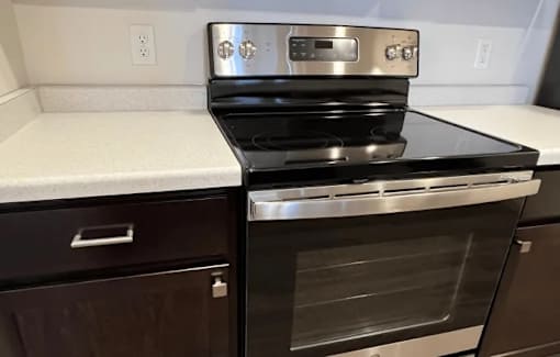 a kitchen with a stove and a counter top