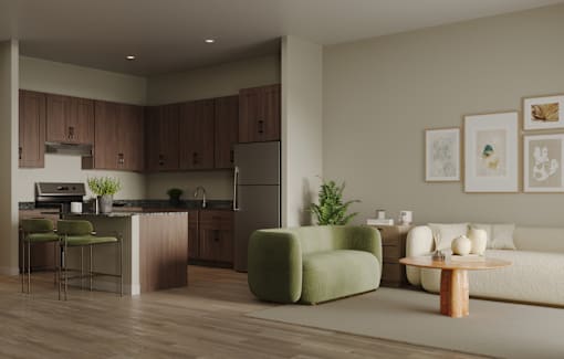 A modern kitchen with a green armchair and a white sofa.