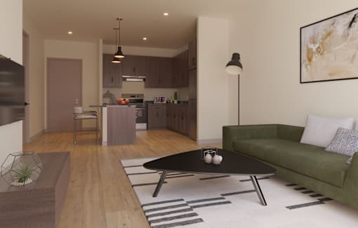 A modern living room with a green couch and a coffee table.