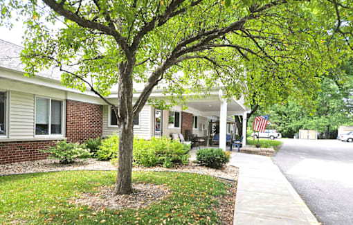 a tree in front of a house