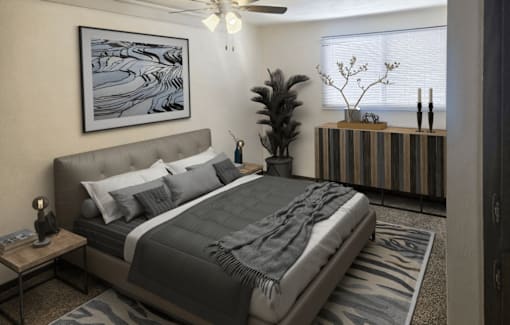 A bedroom with a large bed and a painting on the wall.