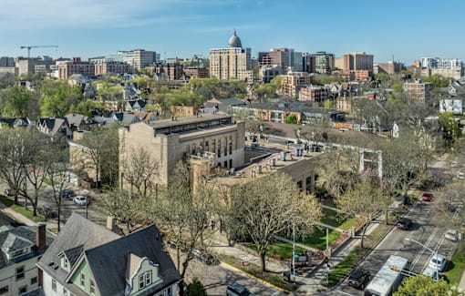 A cityscape with a mix of residential and commercial buildings.