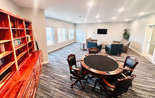 a conference room with a round table and chairs