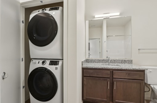 A white washer and dryer in a small laundry room.