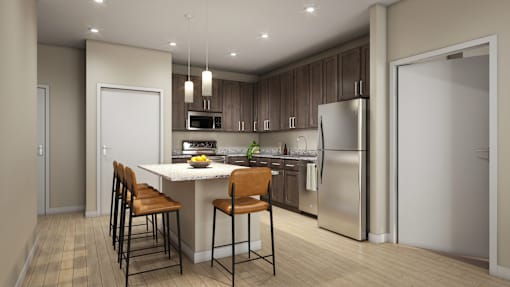 A modern kitchen with a white island and stainless steel appliances.