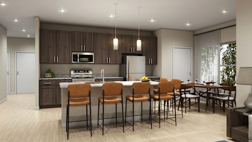 A modern kitchen with brown cabinets and a dining table with chairs.