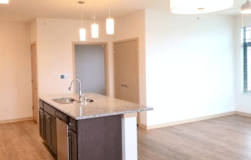 The Madisonian, Senior Housing in Madison WI. Affordable one bedroom apartments, two bedroom apartments and three bedroom townhomes. New building. No smoking. Managed by Wisconsin Management Company