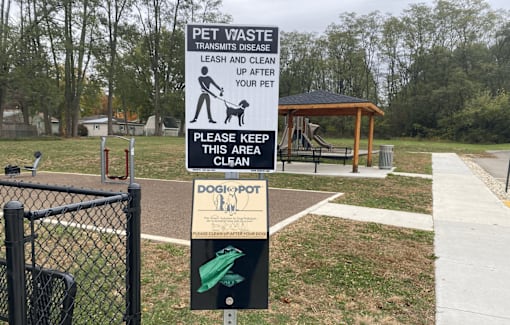 A sign instructs to keep the area clean and to leash and clean up after your pet.