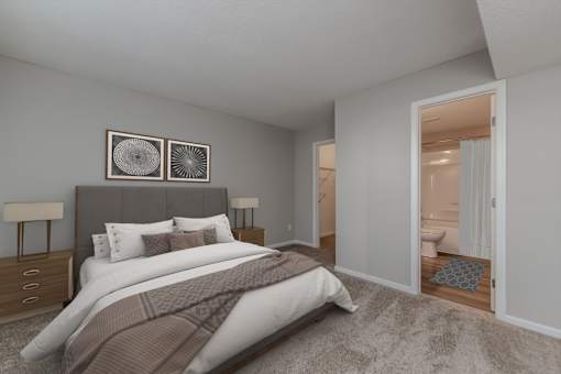 A bedroom with a large bed and two lamps.