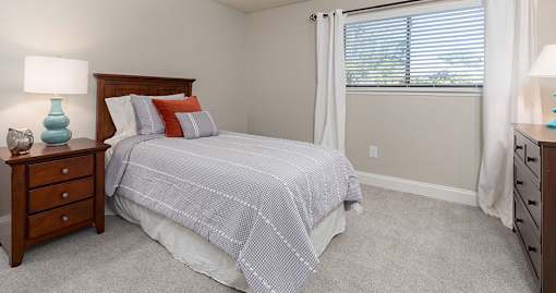 Bedroom with grey bedding