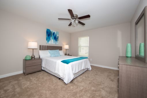 Large bedroom with ceiling fan that is big enough for a king size bed