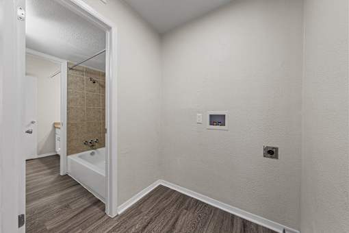 Laundry room with bathroom access and hookups at Parks on the Green Apartments, Texas, 76504