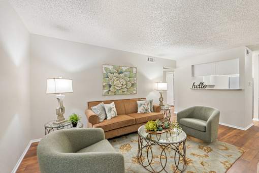 Living room with brown sofa and chairs at Parks on the Green Apartments, Texas, 76504