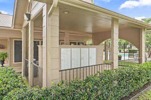 Covered mailbox station with security gates and pool access at Parks on the Green Apartments, Texas, 76504