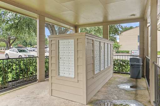 Covered mailbox area with package lockers at Parks on the Green Apartments, Temple, TX 76504
