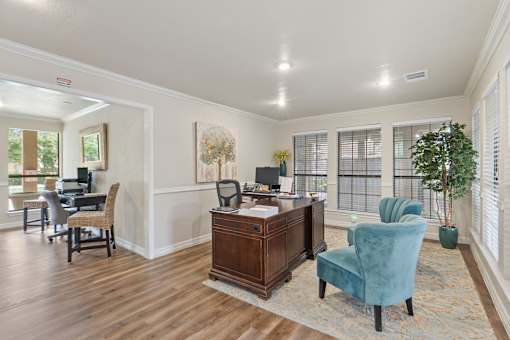 Office space with desk and blue accent chairs at Parks on the Green Apartments, Temple