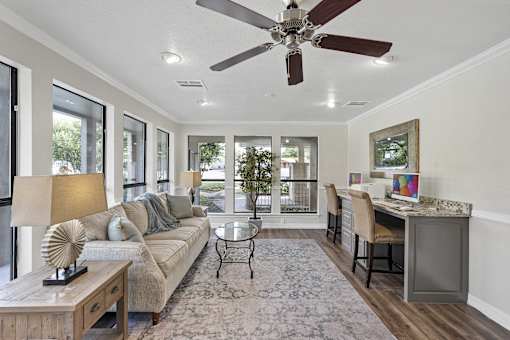 Open concept living and dining space with bar seating at Parks on the Green Apartments, Texas