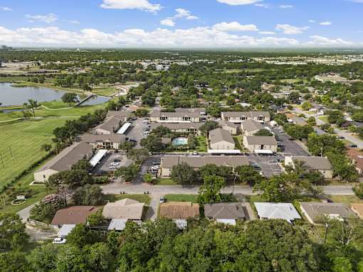Aerial view of apartment community with pool and parking at Parks on the Green Apartments, Texas, 76504