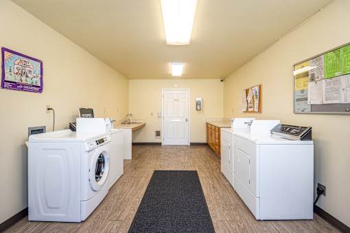 A laundry room with a washer and dryer in it.