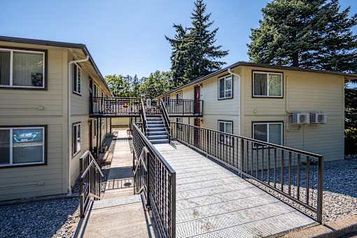 A sunny day at the outdoor deck of a small house.