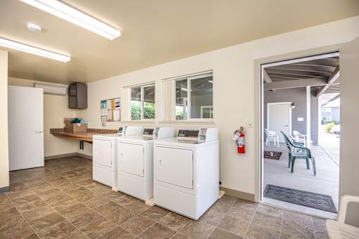 A laundry room with a washer and dryer.