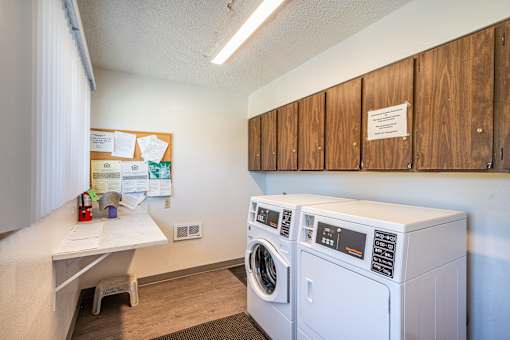 A laundry room with a washer and dryer.