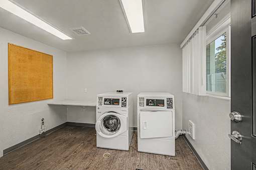 A laundry room with a washer and dryer.
