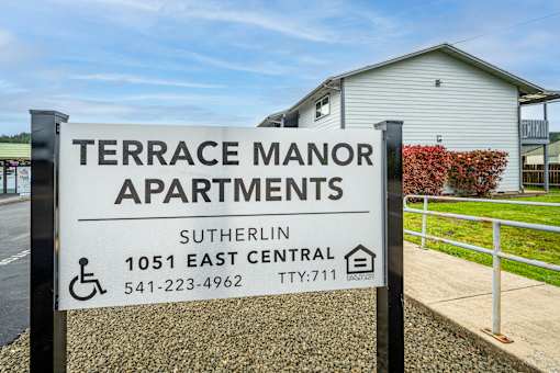 A sign for Terrace Manor Apartments in Sutherlin, Oregon.