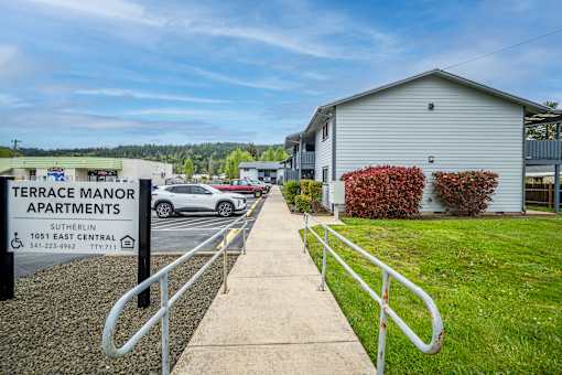 Terrace Manor Apartments is a place with apartments and a car parked in front.