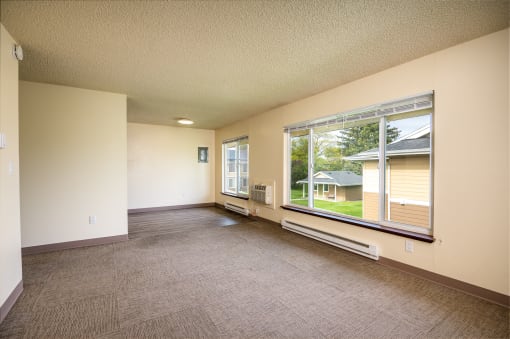 a large window in a room with a carpeted floor