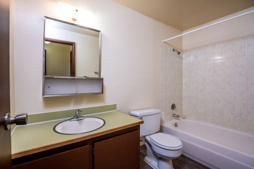 a bathroom with a sink toilet and bathtub